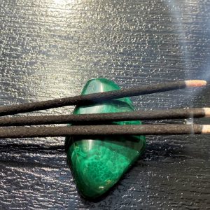 white sage incense on a malachite stone