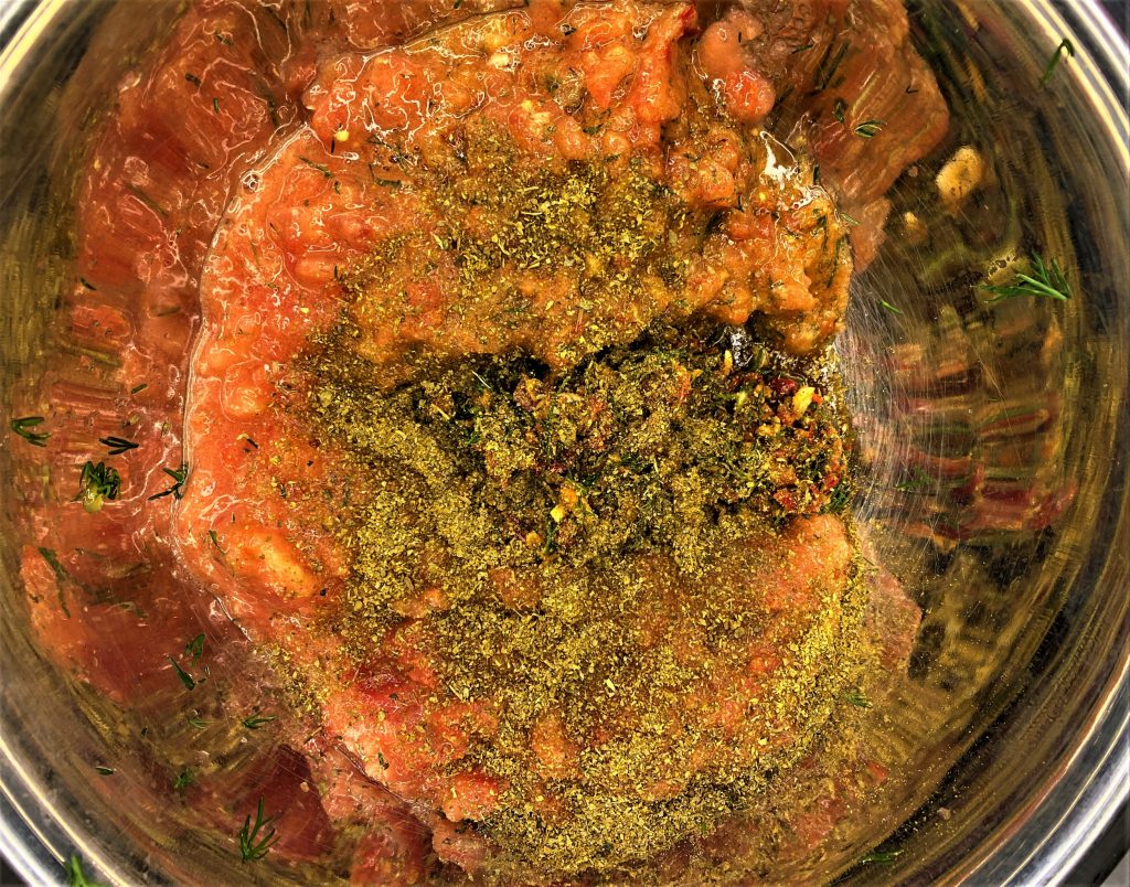 chili garlic dill and khmeli suneli blended with tomatoes for raw adjika