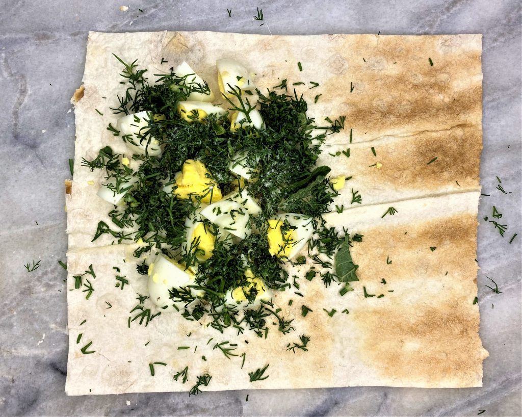 quail eggs and dill in lavash
