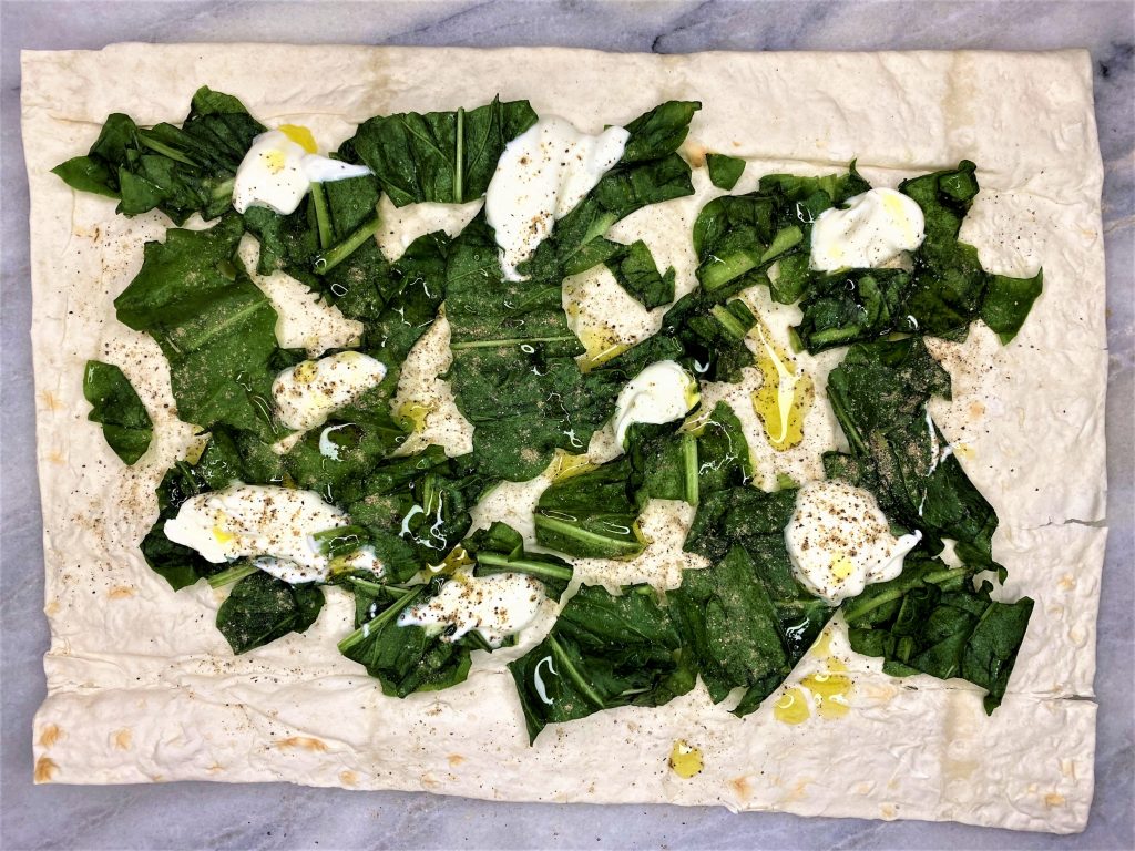 sorrel leaves with olive oil and yogurt on lavash